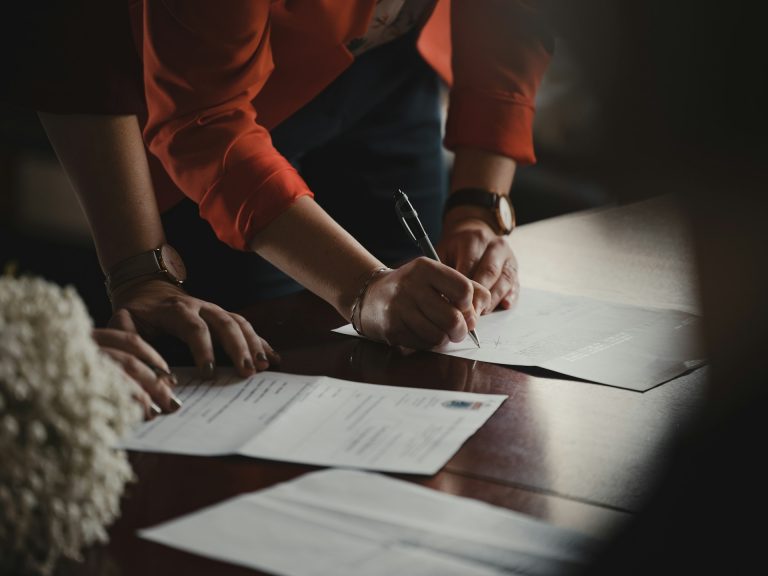 Person signing a legal document