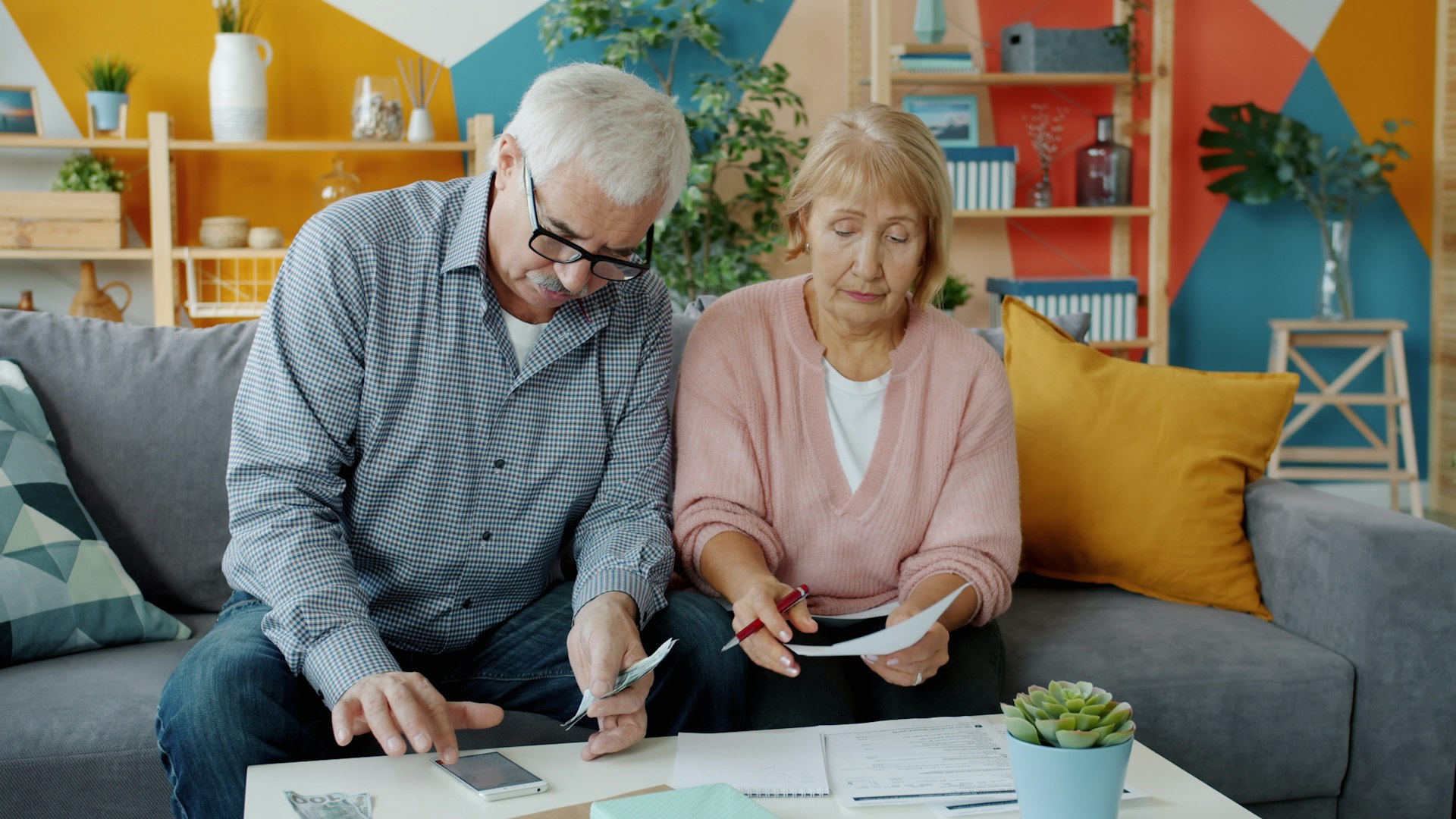 Older couple going through financial documents at home