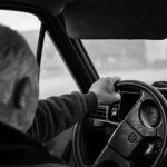 Older man driving a car