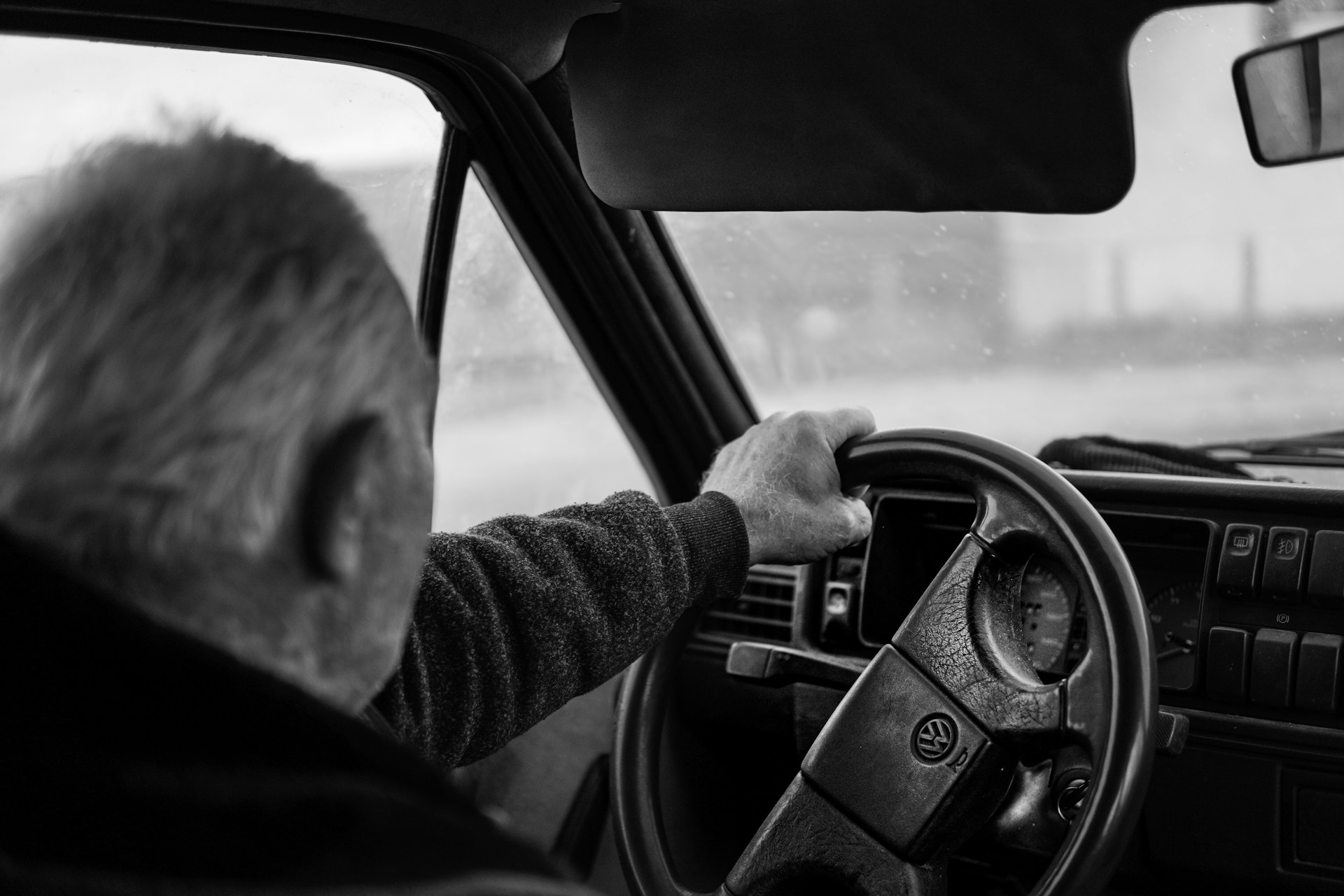 Older man driving a car